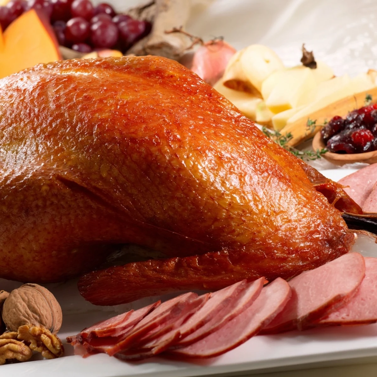 Juicy roasted Thanksgiving Turkey Legs alongside a gourmet charcuterie board, perfect for the holiday feast.