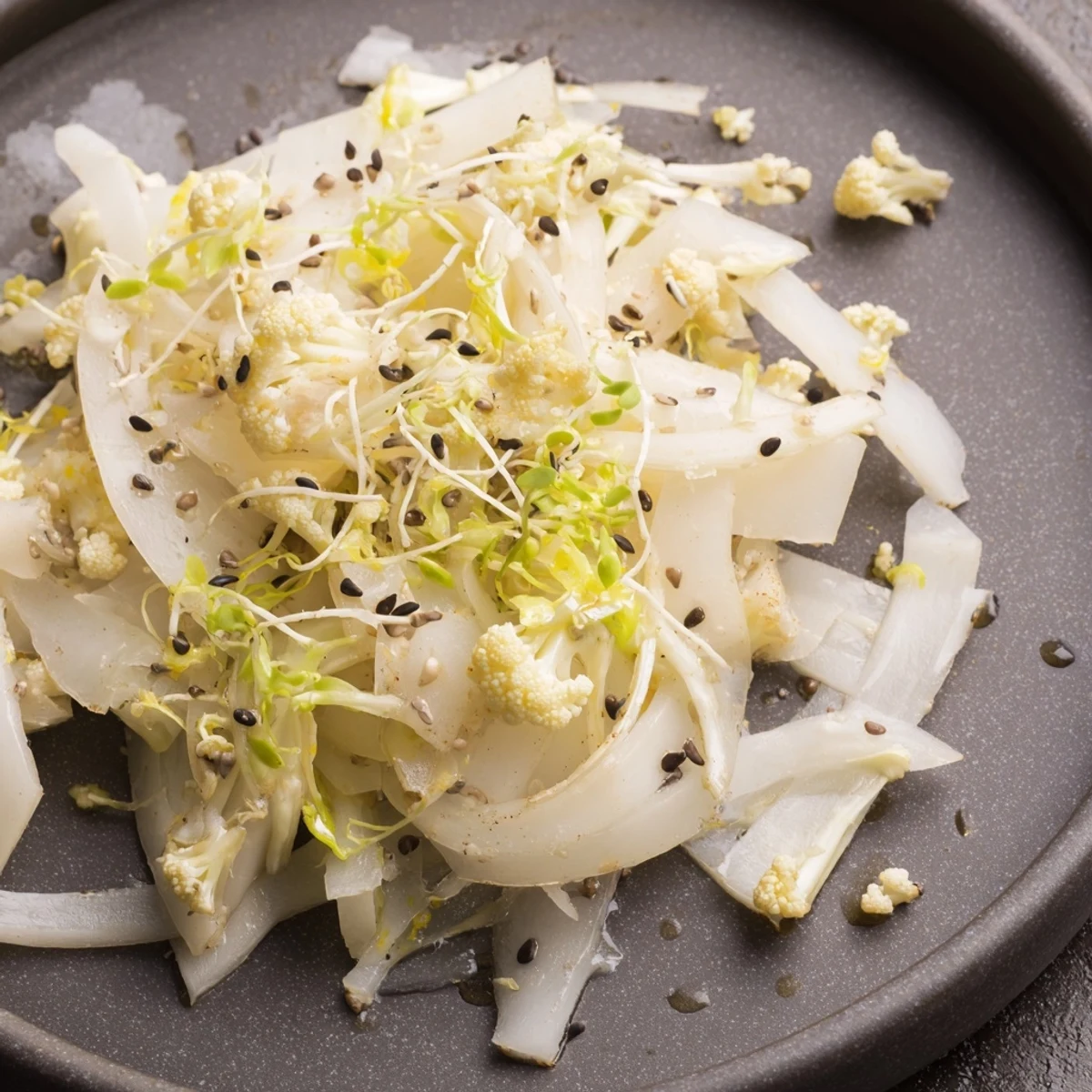 Chilled Tundra Trek appetizer with crisp, thinly sliced vegetables, a minimalist and elegant salad.