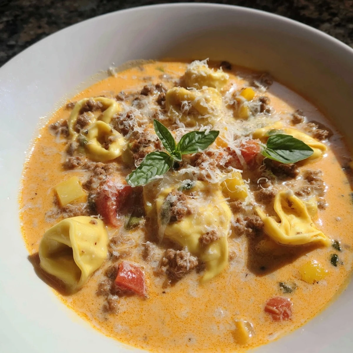 Hearty Italian-American Tortellini Beef Soup with tender tortellini and vegetables, perfect for a cozy supper.