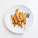 Perfectly roasted Parmesan baby carrot chips, golden and crisp, served as a tasty side dish.