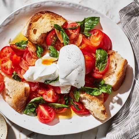 Tomato basil burrata stuffed grilled cheese with melty cheese and golden, crispy bread, ready to eat!