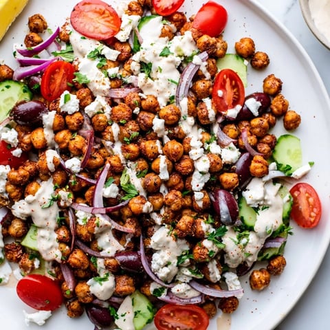 Mediterranean Chickpea Bowl bursting with color: roasted chickpeas, fresh veggies, and creamy tahini dressing.