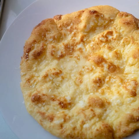 Golden, slightly bubbly cottage cheese flatbread, perfect for scooping up your favorite dips; enjoy!