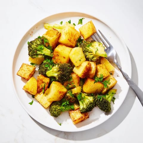 Vibrant image of Roasted Lemon Potatoes and Broccoli, perfectly roasted with tender broccoli florets.