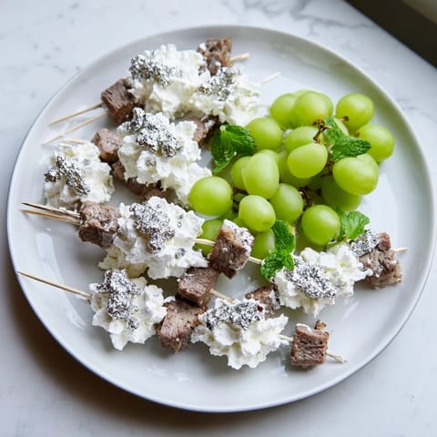This beautiful Fluffy Clouds Lamb Baby Shower Board features tender lamb bites arranged among fluffy cheese clouds and treats.
