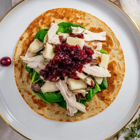 Golden-brown Chicken and Brie Holiday Wraps, perfect for a cozy fall or winter lunch.