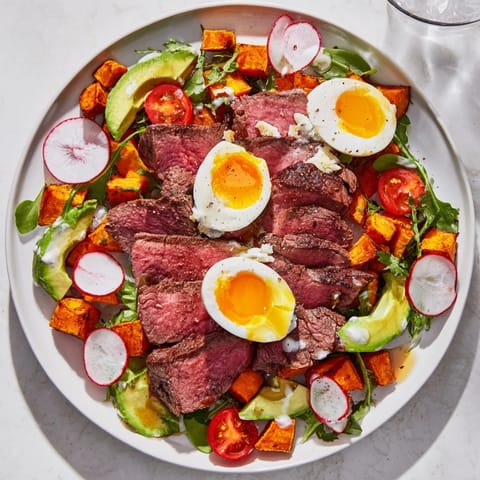 Vibrant High-Protein Beef Avocado Bowl with tender steak, sweet potato, and creamy avocado slices.