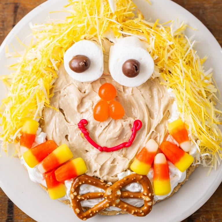 This easy-to-make Scarecrow Candy Platter is overflowing with seasonal candies and treats.